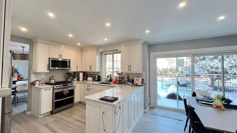 Freshly cleaned kitchen with wiped counters and sink